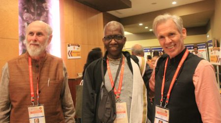 Balabhadra Bhattacarya Dasa (center) at the 2018 World Hindu Congress in Chicago with David Frawley (to his right) and Jeffrey Strong.